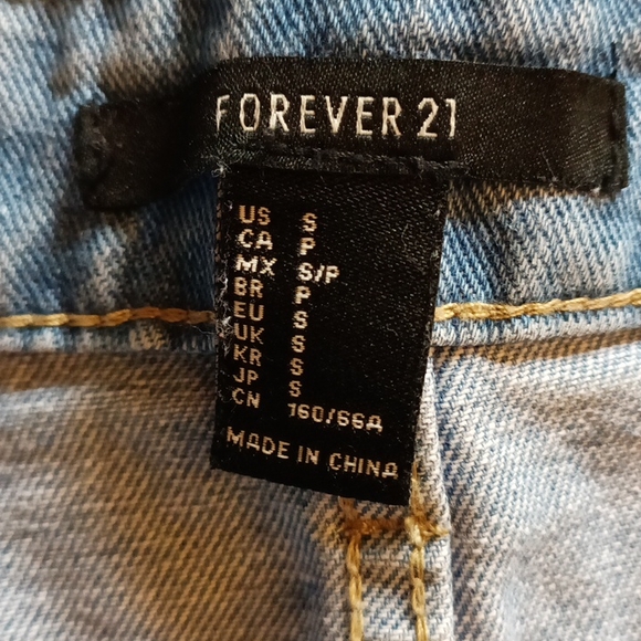 Forever 21 Denim distressed blue jean mini skirt. Button up with fringes. S - Picture 2 of 3